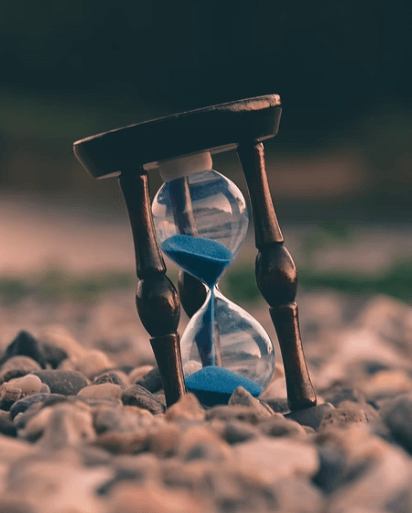 An hourglass kept in a slanted position.