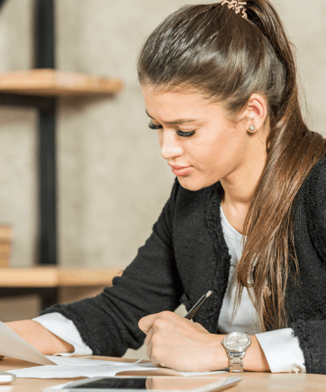An admissions advisor checks transcripts as Bosnian translation services format academia records for evaluation.
