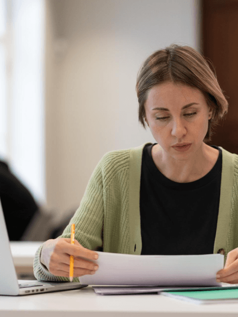 A handwritten transcript is deciphered as Estonian translation services create a clear academic translation for review.