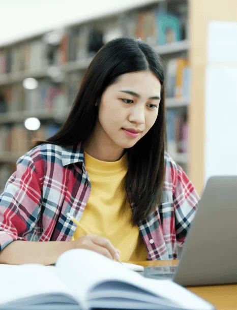 An academic translator checks a scanned transcript page while overnight translation services prepare a deadline-ready file.