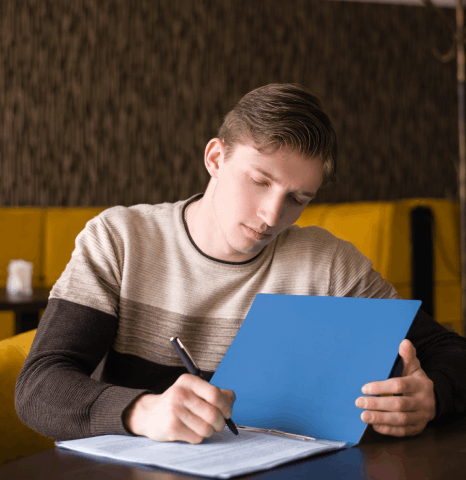 A student checks a transcript table while Slovenian translation services keep grades, ECTS credits, and course titles clear.
