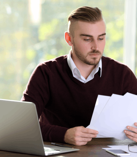 A linguist checks HR policy terms during Human Resources Translation Services to keep accurate wording across updates.