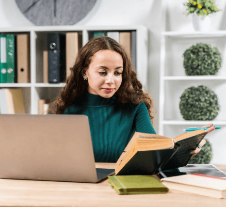 A linguist revises cultural references and tone on a laptop, delivering accurate eBook Translation Services for new readers.