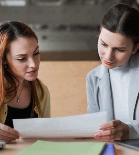 Staffs compare report drafts and glossaries, using translation services for non-profit accurate multilingual content checks.