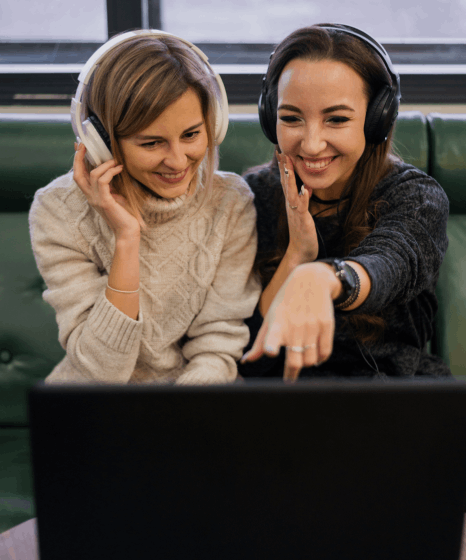 Two editors run a two-stage check on a caption timeline, showing verified spanish captioning services with 99% quality.