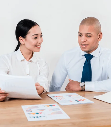 Project managers review a fixed-budget quote for defence translation, confirming affordable rates and on-time delivery.