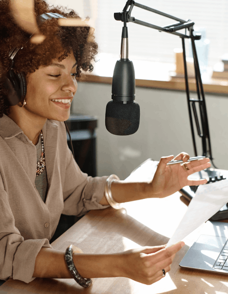 A narrator records E-learning Voiceover Services for all-level online education, switching tone for kids and pros.