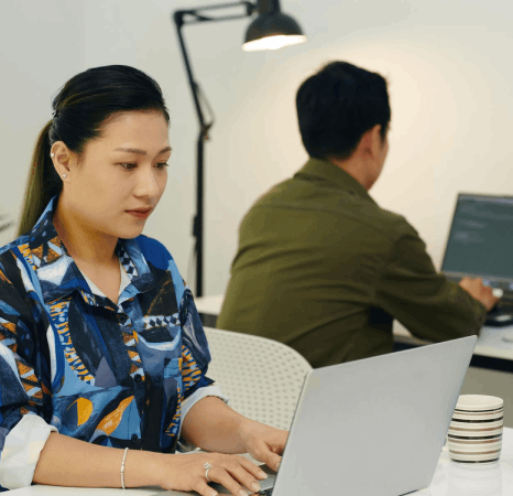 A product team reviews a localized app screen as Javanese translation services fit Javanese text into UI space.