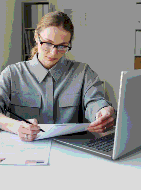 An archivist scans a handwritten Hebrew record and prepares it for Hebrew Translation Services for personal documentation.