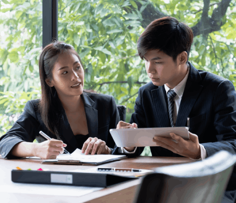 Two linguists run side-by-side edits and a final proof, showing korean translation services new york with quality assurance.