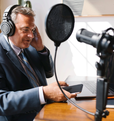 A native narrator records in a sound booth, delivering Portuguese Voice Over Services with clear audio for video ads.