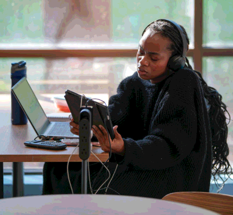 Podcaster reviews speaker names and timestamps in a clean transcript, using Somali Transcription Services for audio content.