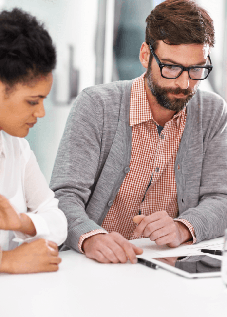Auditors review a certified report packet while fintech translation services prepare compliant submissions for regulators.