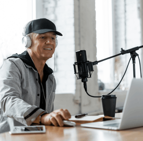 A voice talent records an auto-attendant script as Telephone Voiceover Services create a polished first greeting.