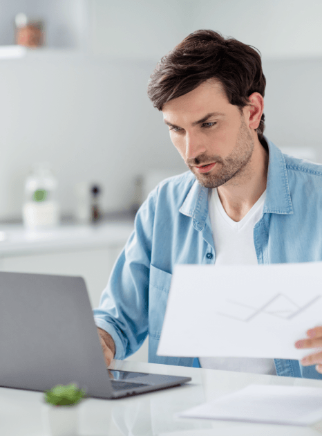 A bank compliance analyst reviews bilingual audit notes using Accounting Translation Services for sector reporting accuracy.