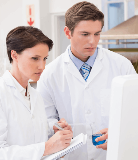 A bioinformatics analyst compares multilingual genomics reports, relying on pharmaceutical translation services for accuracy.