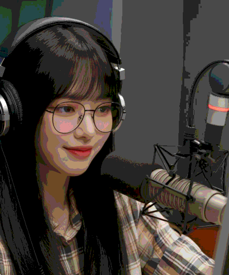 A Korean voice artist records in a treated booth for Korean Voice Over Services, focusing on clear audio delivery.