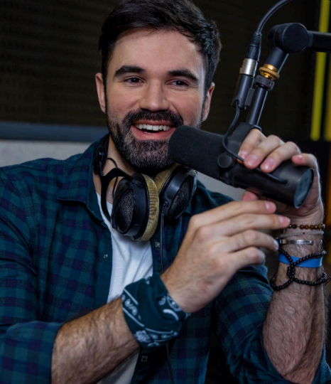 A native talent records lively narration in a studio booth, delivering Italian Voice Over Services for engaging audio.