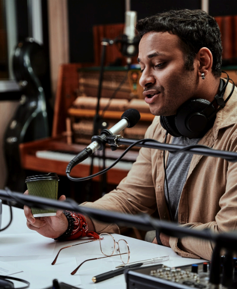 Voice talent records industry-specific eLearning in a studio booth, delivering language voice over services clearly.