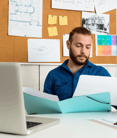 An editor reviews proofs with composition typesetting services for business and academic projects to catch layout errors.