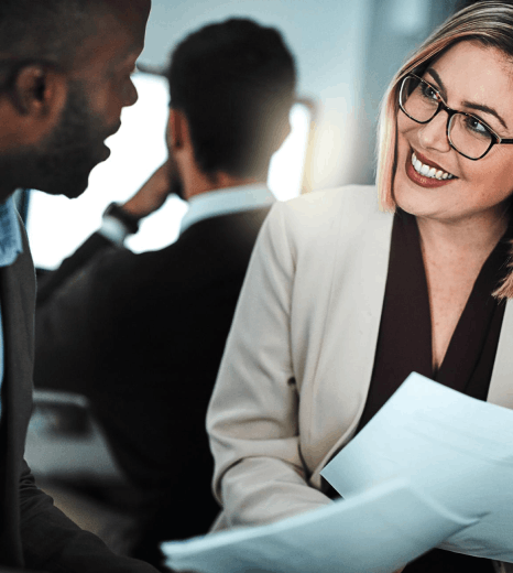 A manager reviews bilingual contracts and terms as Bosnian translation services keep corporate wording consistent.