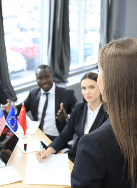 A manager reviews a bilingual client email as Macedonian translation services keep business tone and key terms consistent.
