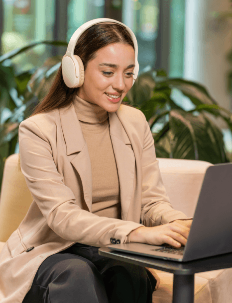 A captioner scrolls a muted feed while corporate video captioning services display business captions that keep the message.