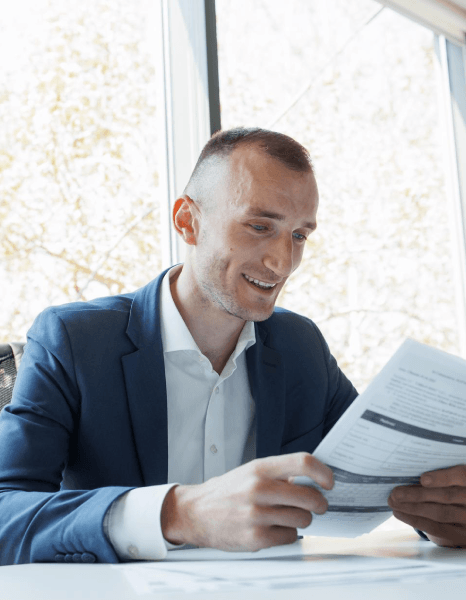 A project manager reviews bilingual contracts as Georgian translation services keep clauses consistent for corporate.