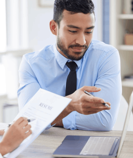 A sales team compares an English pitch deck to the Norwegian version, using Norwegian translation services for business use.
