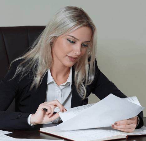 A contracts manager reviews bilingual clauses, using Slovak translation services for a corporate agreement package.