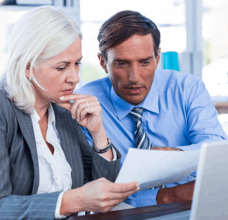 Business peoples edits a supplier quotation in two languages, using same day translation services for business pricing.