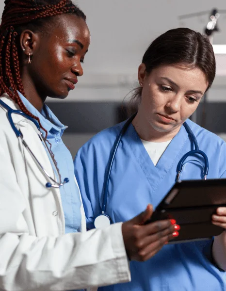 A doctor signs a translated care summary as speed translation services deliver medical updates for cross-language follow-up.