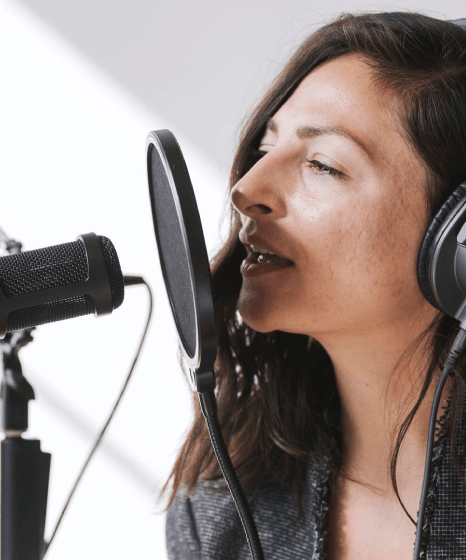 An editor syncs multilingual scripts on screen as Deep Voiceover Services keep global brand narration consistent.