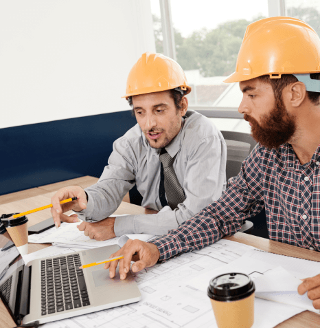 Two reviewers complete certified Architectural Translation Services QA, checking ISO steps, terms and final verification.
