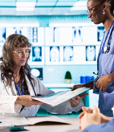 A researcher compares certified protocol sections on a laptop, using clinical trials translation services in New York.