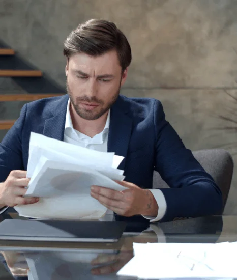 A specialist uploads certified translations to an ITAR compliance portal, demonstrating defence translation services.