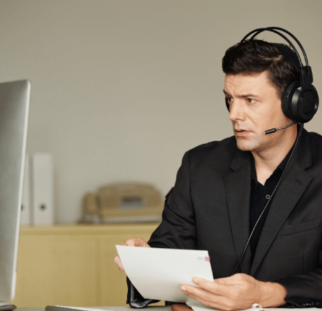 A certified linguist captions a drama scene as Netflix captioning services follow genre terms and an accuracy checklist.