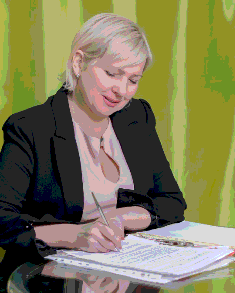 A linguist checks seals and dates on an official record, preparing certified Somali Translation Services for filing.