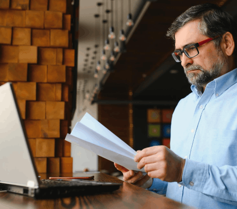 A government clerk compares stamped records during certified vital document translation for accurate public file approvals.