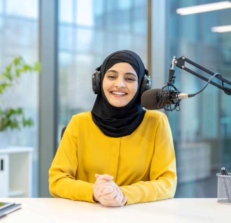Urdu voice talent records Urdu Voice Over Services with a pop filter and acoustic panels for clear audio voiceover.