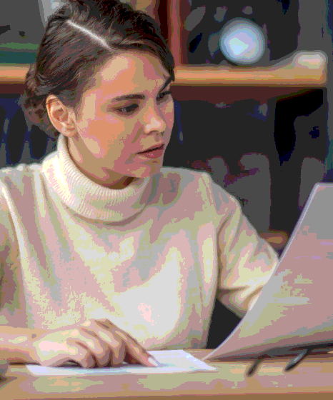 A translator refines a business email for clear communication, using Amharic Translation Services to preserve tone.