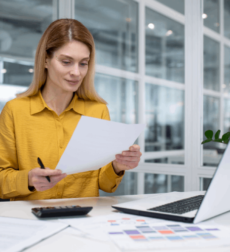 A layout specialist uses composition typesetting services to create clear readable content with clean headings and spacing.