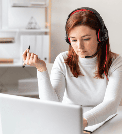 A transcriber working to provide clear sermon transcripts for hearing-impaired individuals in a church setting. A transcriber working to provide clear sermon transcripts for hearing-impaired individuals in a church setting.