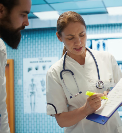 A nurse checks translated discharge instructions from pharmaceutical translation services in New York for clinic patients.
