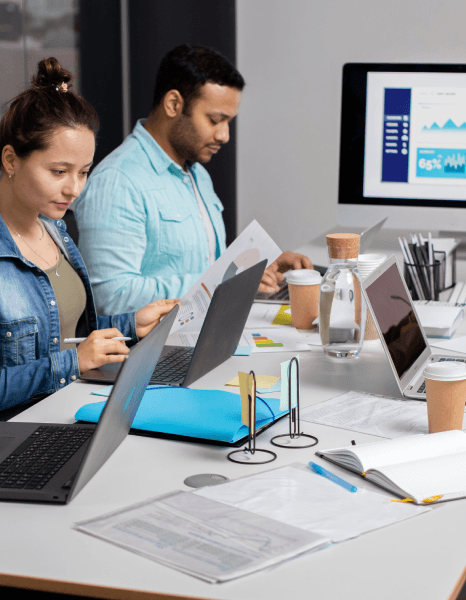 A marketing team signs off final layouts to ensure a consistent message using Catalog Translation Services for new markets.