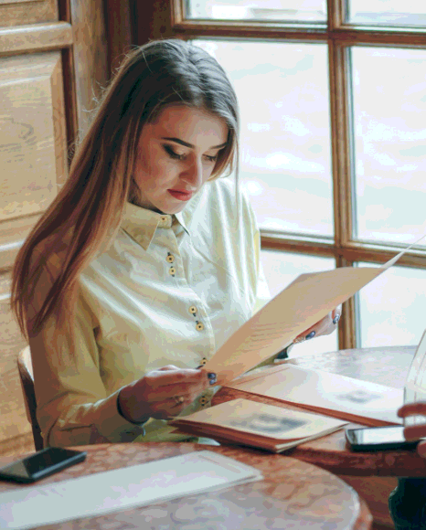 A legal assistant scans a signed contract for certified Greek Translation Services before filing it with the court.