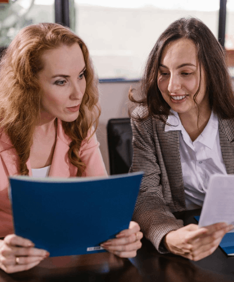 A legal team marks clauses for industry compliance while using french translation services on cross-border contracts.