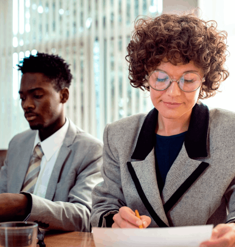 A lawyer reviews a bilingual contract as Basque translation services preserve legal terms and clause meaning for signing.