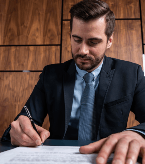 A lawyer reviews a bilingual contract draft, using Croatian translation services to preserve legal terms for filing.