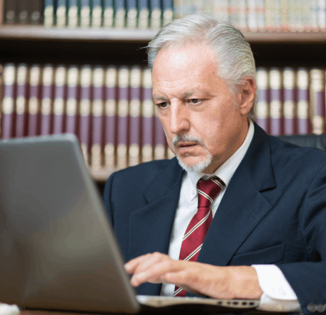A legal assistant compares a contract clause line by line, using flemish translation services for legal filings.